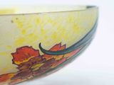 a close up of a bowl on a white surface