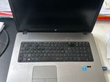 a laptop computer sitting on top of a desk