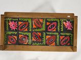 a picture of a wooden box with a picture of flowers on it