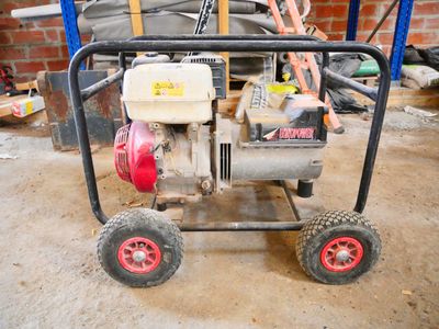 an image of a small engine on a cart in a garage