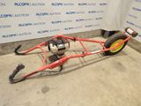 a red bike with a yellow wheel attached to it