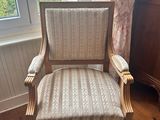 a chair that is sitting in front of a window