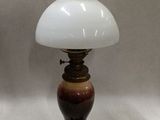 pair of antique lamps with white and brown glass shades