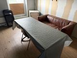 an image of a living room with a couch and a table