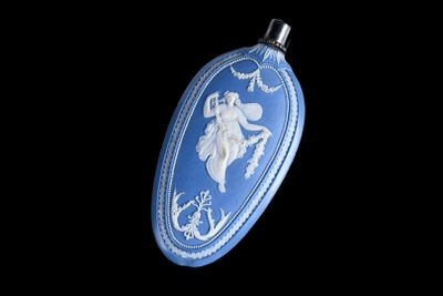 an image of a blue and white christmas ornament hanging on a black background