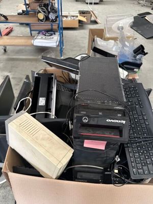 a cardboard box with a computer and a keyboard in it