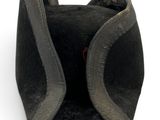 a black hat with a red button on it