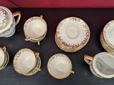 a lot of cups and saucers on the table