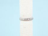 a close up of a ring on top of a white cloth
