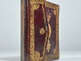 an old book that is sitting on a table