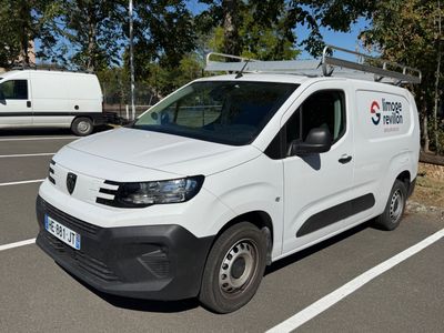 a white van that is parked in a parking lot