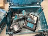 many tools in a blue box on the floor