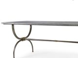 the table is made of metal and has a marble top