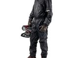 the man in the rain suit is holding a helmet and helmet