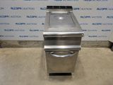an image of a stainless steel stove sitting in front of a wall