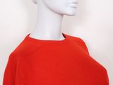 an image of a mannequin wearing a red sweater and hat