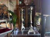 a glass table with a clock on top of it in a living room
