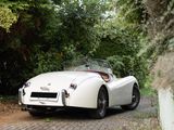 a white sports car parked on the side of the road