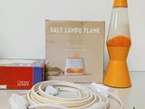 a lamp that is sitting on a table next to a box of cords