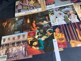 a lot of old movie posters on the table