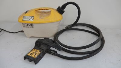 a yellow and black blow dryer sitting on top of a white table