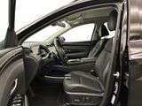 the interior of a car with the door open and the driver ' s seat down