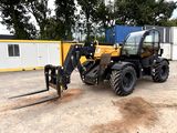 a picture of a tractor with a fork attached to it ' s back