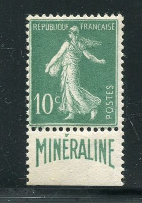 the stamp is green and white with a woman on it