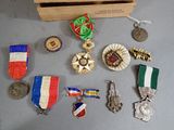 many medals and medals on display in a wooden box