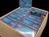 a box of pokemon trading cards on a black background