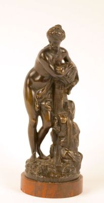 bronze statue of a woman on a horse with a child