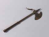 an old metal axe with a long handle on a white surface