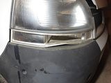 a close up of a car ' s headlight and front bumper