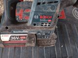 a bosch power tool that is sitting on top of a table