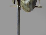 a statue of a man with a helmet on a stand