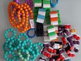 a lot of beads and bracelets on a table