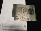 a black and white photo of a postcard with a picture of a clock