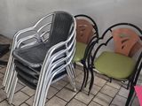 many chairs that are lined up against a wall