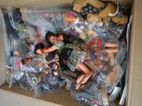 a box full of dolls and stuffed animals inside of it