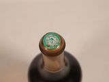 a close up of a bottle of wine on a table