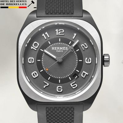 a close up of a watch with a black face