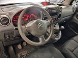 a dashboard of a small car with a clock on it