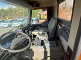 a view of the inside of a truck from the driver ' s seat