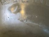 a close up view of a metal bowl with a handle