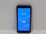 the phone is sitting on a table with a blue screen