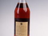 an empty bottle of alcohol sitting on top of a white surface