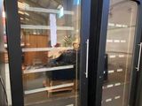 two glass doors that are open in a room