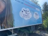 a truck with a picture of a woman on the side of it