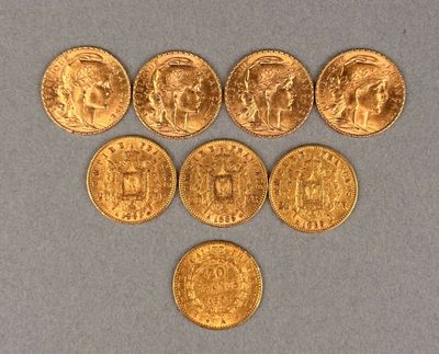 six gold coins are arranged in the shape of a heart