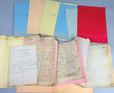 many old papers on a table with a blue background